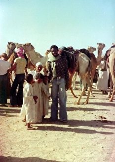 British Caribbean man with Omani children in Oman British Caribbean man with Omani children in Oman