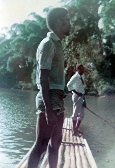 British Caribbean man standing on raft on the Rio Grande, Jam British Caribbean man standing on raft on the Rio Grande, Jam