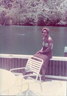 British Caribbean woman sitting by the Blue Lagoon in Port A British Caribbean woman sitting by the Blue Lagoon in Port A