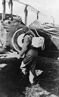 Royal Air Force Pilot Prints: British pilot getting into his plane, WW1