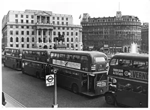 Prints of Four Routemaster London buses in a queue on the National Gallery side of Trafalgar Square, with the South African embassy in the background Trafalgar Square Prints: Routemaster Buses in Trafalgar Square Print