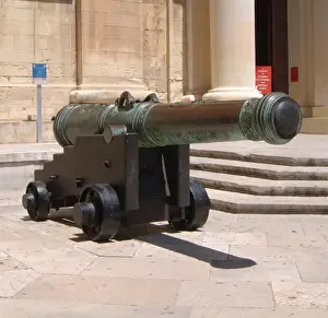 Prints of A cannon displayed outside the St John Cathedral (viewed from St John Square) at Valletta Valletta Prints: Cannon Print from Valletta Malta