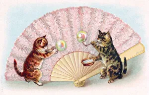 Two cats blowing bubbles on a greetings postcard Two cats blowing bubbles on a greetings postcard