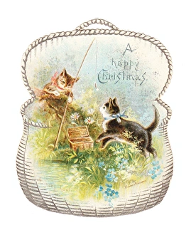 Two cats fishing on a cutout Christmas card Two cats fishing on a cutout Christmas card