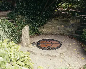 Prints of Chalice Well, a holy well located at the foot of Glastonbury Tor, Somerset. Date: 20th century Well Prints: 20th Century Print of Chalice Well, Glastonbury Tor