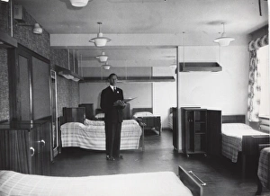 Checking a dormitory at Baden Powell House, London Checking a dormitory at Baden Powell House, London