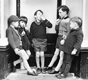 Children with ice lollies on a Balham street, SW London Children with ice lollies on a Balham street, SW London