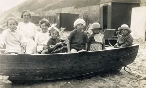 Children playing in rowing boat on beach at Gorleston-on-Sea Children playing in rowing boat on beach at Gorleston-on-Sea