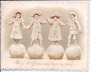 Four children stand on large snowballs on a Christmas card Four children stand on large snowballs on a Christmas card