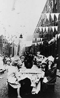 Children at a street party with bunting Children at a street party with bunting