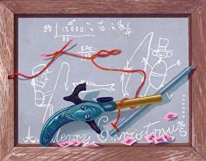 Childs slate and toy gun on a Christmas card Childs slate and toy gun on a Christmas card