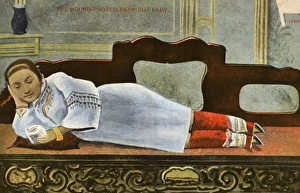 China - Shanghai - Woman with bound feet reclining on divan China - Shanghai - Woman with bound feet reclining on divan