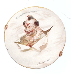 Clown with head through paper on a Christmas card Clown with head through paper on a Christmas card