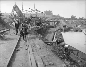 Coal Mining Prints: Coal Barges Print: Pit Pony and Heavy Coal Trucks on Canal Rails