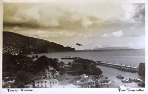 Prints of Coastal view of Funchal, Madeira, Portugal with seaplane taking off on the regular mainland service. Date: circa 1940s Portugal Prints: Coastal View of Funchal, Madeira Print circa 1940s