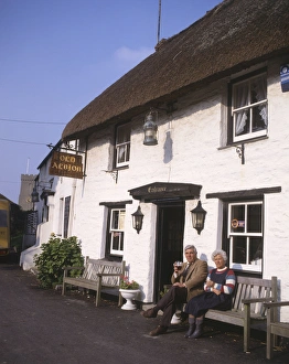 Couple outside Old Albion Inn, Crantock, Cornwall Couple outside Old Albion Inn, Crantock, Cornwall