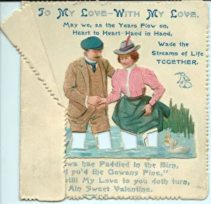 Couple wading through water on a Valentine card Couple wading through water on a Valentine card