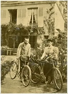 Marie and Pierre Curie Print: A photograph of the couple on bicycles