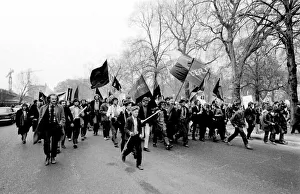 Demonstration in London -- young protesters walking purposefully along a road Demonstration in London -- young protesters walking purposefully along a road