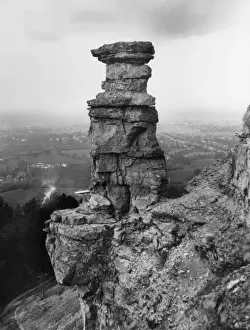 Prints of The Devils Chimney, a distintive natural rock formation on Leckhampton Hill, overlooking the road between Cheltenham and Birdlip, Gloucestershire, England. Date: late 1930s Gloucestershire Prints: The Devils Chimney Print, Leckhampton Hill, Gloucestershire