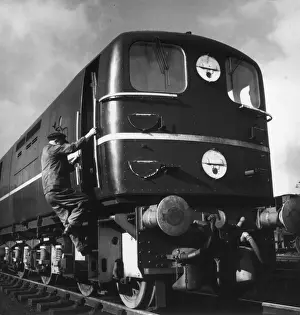 A Driver Climbs into his Cab Print