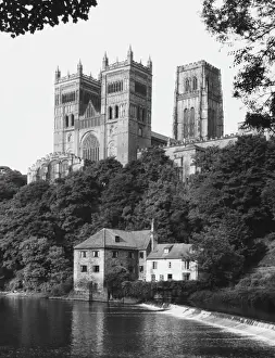 Prints of Durham Cathedral, viewed from across the River Wear. The main part is Norman, built between 1093 and 1133. The impressive central tower was built around 1470 Durham Prints: Durham Cathedral Print: Norman Architecture and Central Tower