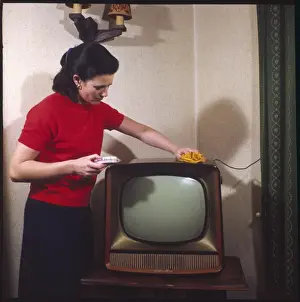 Vintage Domestic Scene Prints: Dusting a Television