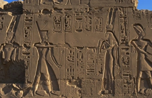 Egyptian Art. Karnak. A pharaoh before a god. Relief Egyptian Art. Karnak. A pharaoh before a god. Relief
