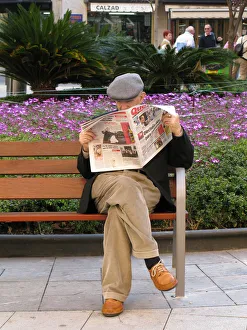 An elderly man wearing a grey cloth cap - Palma Mallorca An elderly man wearing a grey cloth cap - Palma Mallorca
