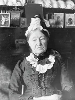 Elderly woman in front of a Welsh dresser, Mid Wales Elderly woman in front of a Welsh dresser, Mid Wales