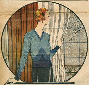 Elegant 1930s woman looking at snow from a window Elegant 1930s woman looking at snow from a window