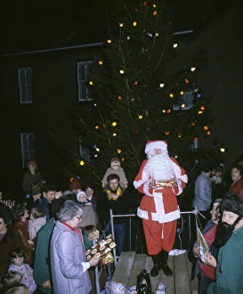 Father Christmas with tree and presents Father Christmas with tree and presents