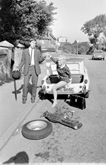 Female contortionist Diana Gaye and car boot Female contortionist Diana Gaye and car boot