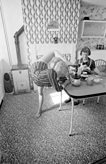 Female contortionist Diana Gaye making tea Female contortionist Diana Gaye making tea