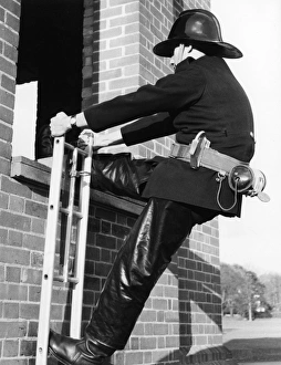 Firefighter during hook ladder practice Firefighter during hook ladder practice