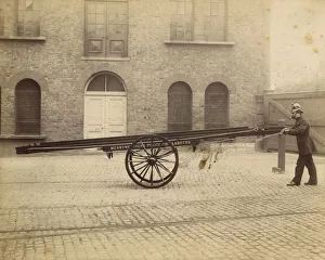 A firefighter with a Merryweather wheeled ladder escape A firefighter with a Merryweather wheeled ladder escape