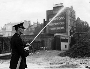 Firefighter in Orange Street, London W1, WW2 Firefighter in Orange Street, London W1, WW2