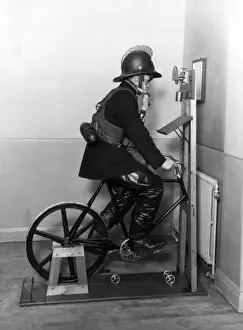 Historical Firefighting Images Prints: Firefighter undergoing ergometer test