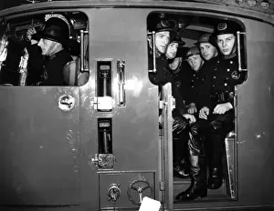 WWII Firefighting Vehicles Prints: Firefighters in a fire engine, WW2