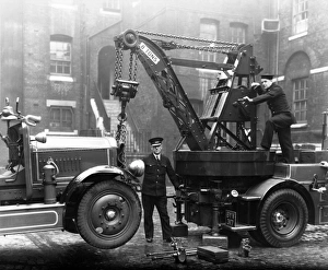 Firefighters operating a Dennis breakdown lorry Firefighters operating a Dennis breakdown lorry