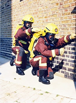 Firefighters in training with breathing apparatus Firefighters in training with breathing apparatus