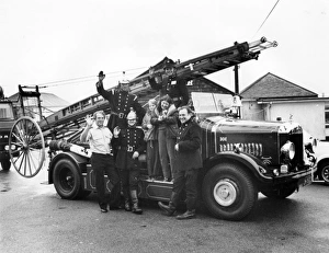 Firemen and children with 1927 Dennis fire engine Firemen and children with 1927 Dennis fire engine
