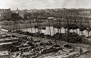 Fishing boats and barrels in the harbour at Wick, Scotland Fishing boats and barrels in the harbour at Wick, Scotland