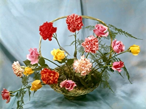 Flower arrangement with roses and carnations Flower arrangement with roses and carnations
