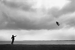 Flying a Chinese kite on the banks of the River Mersey Flying a Chinese kite on the banks of the River Mersey