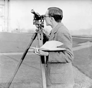 Prints of Forecasting the weather at the Air Ministry, Kew, London - observing a balloon to gauge windspeed levels. Date: early 1930s Weather Prints: Forecasting Weather at Kew, London Print, Early 1930s