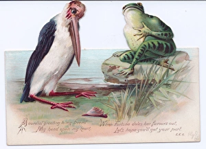 Frog and stork on a cutout Christmas card Frog and stork on a cutout Christmas card