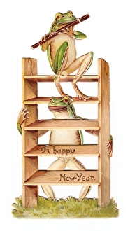 Two frogs with flute and ladder on a New Year card Two frogs with flute and ladder on a New Year card