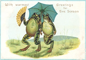 Two frogs with parasol on a Christmas card Two frogs with parasol on a Christmas card