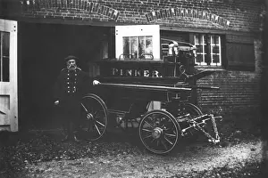 Prints of George Beaumont, Chief Officer of the Pinner Voluntary Fire Brigade, with a manual fire engine which was kept at Waxwell Lane, Pinner, having previously been housed at The Hall Middlesex Prints: George Beaumont with Manual Fire Engine Print, 1890